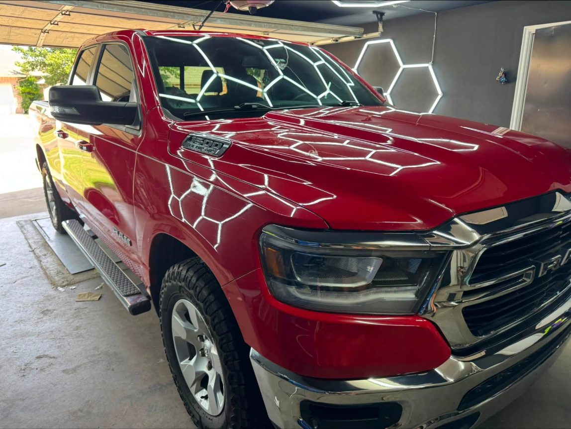 Red Ram 1500 front three-quarter in the shop after coating